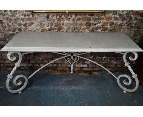 A contemporary marble top console table, raised on a scrolling wrought iron base (the top cracked / repaired and braced) leng