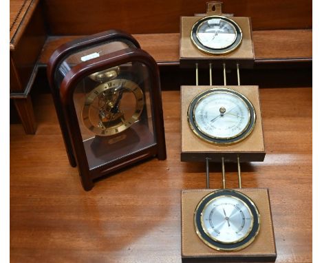 A modern German Hermle skeleton clock in perspect-glazed case, to/w a leather-mounted barometer with hygrometer and thermomet