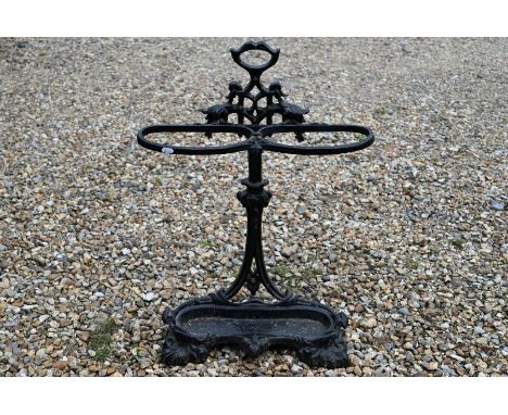Victorian cast iron black painted stick stand, with remarkable drip tray, 75 cm high