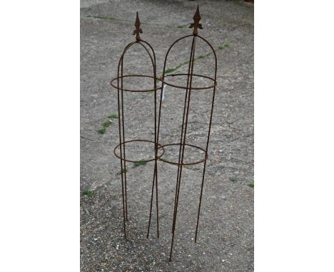 A pair small weathered steel arrow head obelisks, 109 cm high x 23 cm diam (2)
