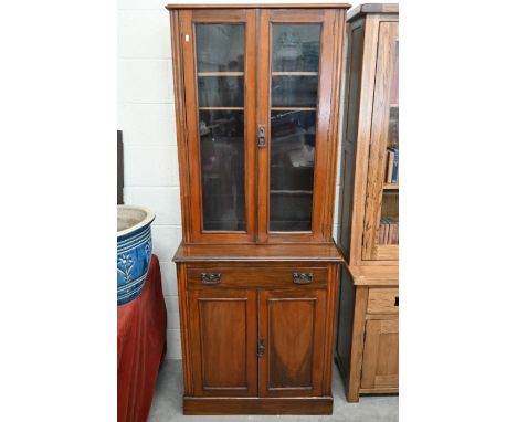 &nbsp;An Edwardian mahogany chiffonier bookcase, the glazed doors enclosing three adjustable shelves on cabinet base with sin