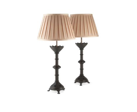  ENGLISH PAIR OF GOTHIC REVIVAL CONVERTED CANDLESTICKS, CIRCA 1880 patinated bronze, later converted to table lamps, with ass
