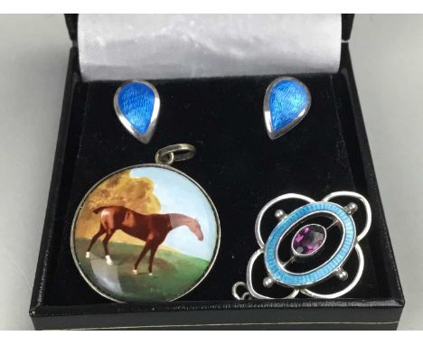 SILVER AND ENAMEL HORSE PENDANT,of circular form and with a standing horse in landscape, along with a pair of enamel earrings