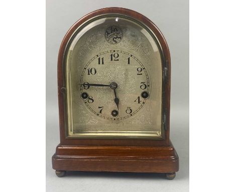 EDWARDIAN MAHOGANY MANTEL CLOCK,with arched silverised dial, 25cm high