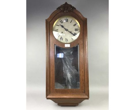 OAK FRAMED WALL CLOCK,78cm long, with pendulum