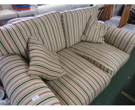 TWO SEATER SOFA IN STRIPED PATTERN WITH TWO SCATTER CUSHIONS.