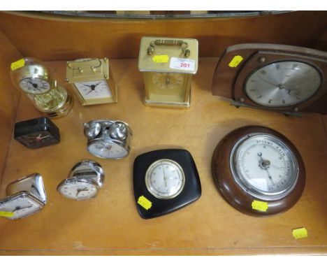 SELECTION OF TRAVEL CLOCKS , MANTEL CLOCKS TOGETHER WITH A OAK MOUNTED BAROMETER, AND THERMOMETER.