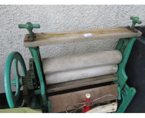 A VINTAGE MANGLE PAINTED GREEN.