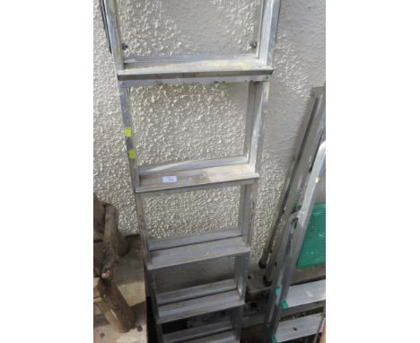 A THREE-WAY ALUMINIUM LADDER.