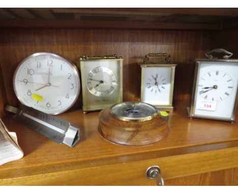 THREE QUARTZ MANTEL CLOCKS, A WALL CLOCK, MOUNTED BAROMETER AND A COOKMETER THERMOMETER.