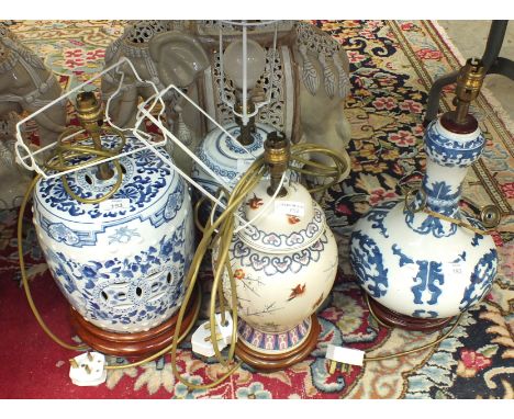A collection of four modern Oriental decorated ceramic table lamps.