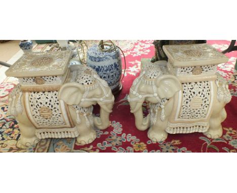 A pair of modern Oriental ceramic elephant garden seats, 40cm high, (2).