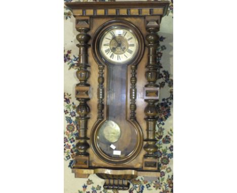 A Walnut-cased Vienna-style wall clock, 100cm high.