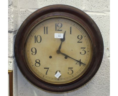 A stained wood circular striking wall clock, 40cm diameter, a mahogany finish striking wall clock, the dial marked C Wood &am