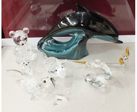 A Swarovski crystal bear, 6.5cm high, a pig, a small cat, a seal (a/f), an oyster with pearl and a Poole Pottery dolphin, (6)