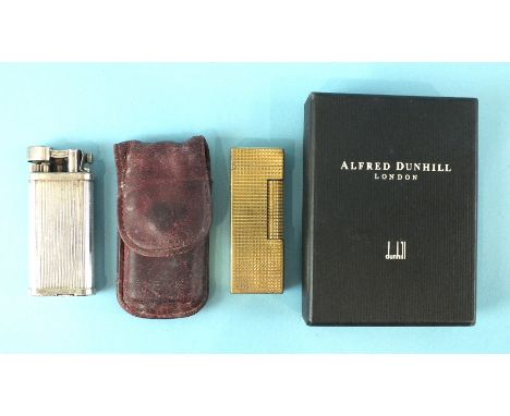 A Dunhill 'Unique' lighter numbered 480735, in pouch and a Dunhill gold-plated lighter in worn condition, in Alfred Dunhill b
