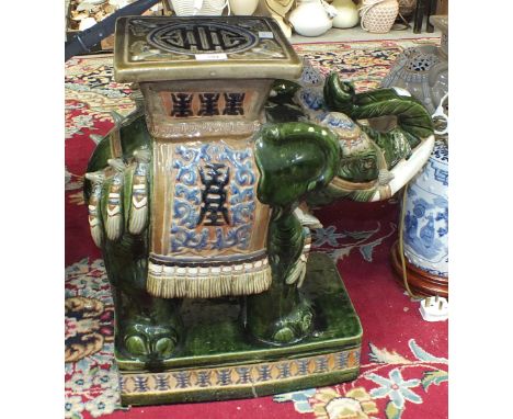 A modern Oriental ceramic elephant garden seat, 56cm high.