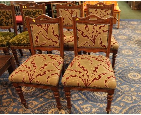 Four oak chairs with matching tapestry upholstery