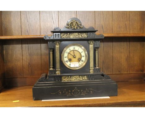 Ornate slate mantle clock, decorated with brass cherubs, 36 cm high 