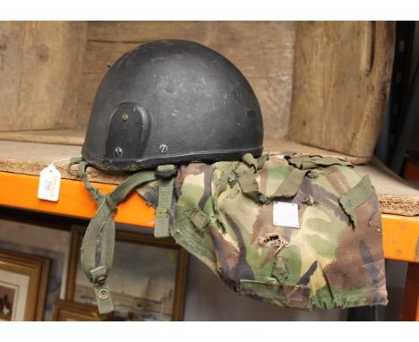 Army helmet with camouflage cover