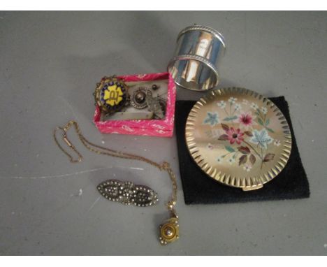 A small group of jewellery items to include an early Victorian gilt metal pendant set with split seed pearls, the centre pear