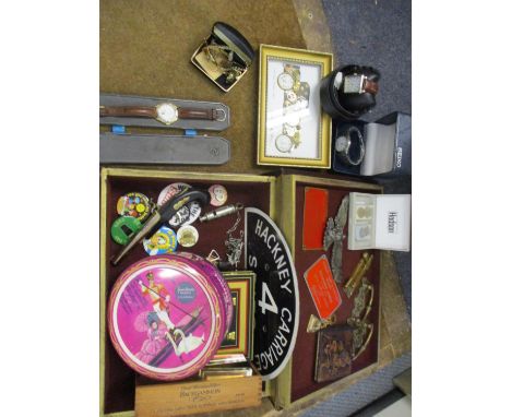 An assortment of items to include badges and watches, a Hackney Carriage and other signs, door hardware and a vintage Metropo