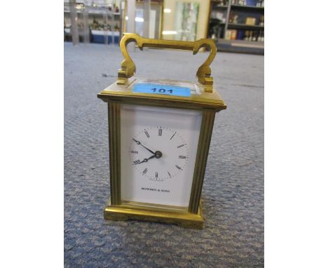 A Bowden &amp; Sons five window carriage clock with key, and a mid 20th century anniversary clock under a glass dome 