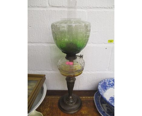 A Victorian cast metal and clear glass oil lamp with a green etched shade, 26 1/2"h 