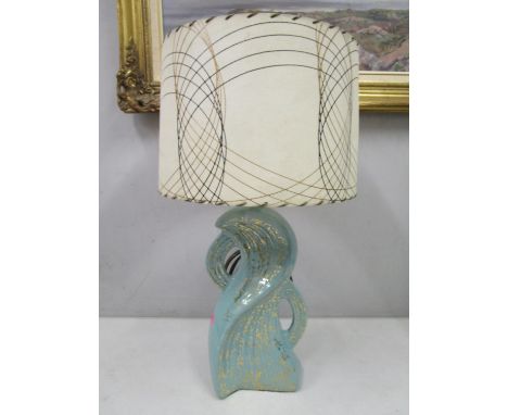 A 1950s American gold and green ceramic irregular shaped table lamp with a fibre glass shade, pat tested and re-wired Positio
