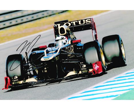 Motor Racing Kimi Raikkonen signed Lotus Formula One 12x8 colour photo. Nicknamed The Iceman is a Finnish racing driver who c