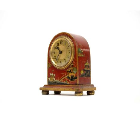 A French Chinoisere miniature mantel clock, the brass face with Arabic dial, in domed red case decorated with figural scene, 