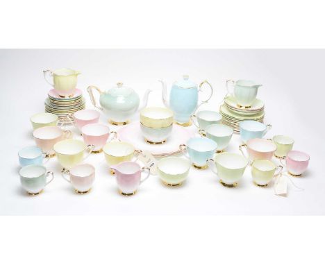 A Queen Anne harlequin tea and coffee service, including: twelve tea trios, six coffee cups and saucers, three cream jugs and