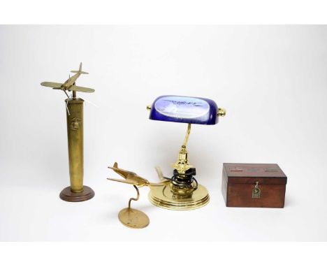 A collection of military interest memorabilia and desk accessories, including: a WWII ‘The Sleeping Lion Awakes’ Japan Attack