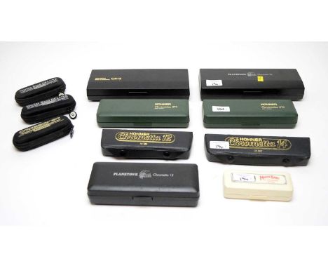 A Hohner Chrometta 12 harmonica; a Hohner Chrometta 14 harmonica; two Hohner Chromonica 270 harmonicas; two Hohner Marine Ban