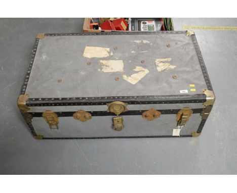 A vintage brass bound travel chest, by Mossman London, the hinge top opening to reveal lift out compartment and unfitted inte