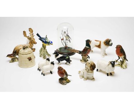 A collection of Beswick animal figures, including: a stag, modelled lying down, MEASUREMENT; a wren; sheep and a sheepdog; to