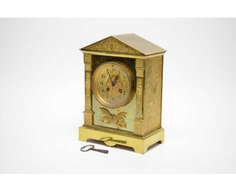 A 19th Century French brass mantel clock, the gilt Arabic dial within an architectural case with faux pillar supports, with M