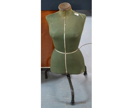 A vintage cloth covered female mannequin or dress maker’s dummy, on adjustable metal stand, 69cms high (excluding stand). 