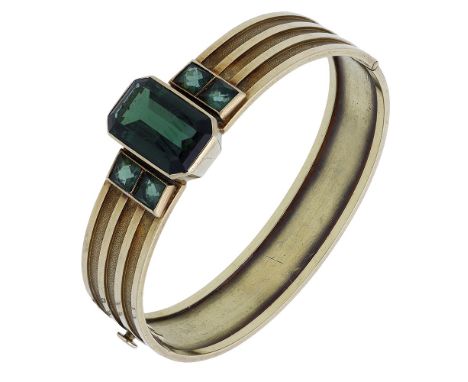 A mid 20th century tourmaline bangle by Willi Stoll, the step-cut tourmaline collet-set between duos of square-shaped tourmal