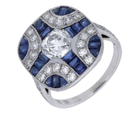 A sapphire and diamond panel ring, centred with a cushion-shaped old-cut diamond and set throughout with vari-cut sapphires, 
