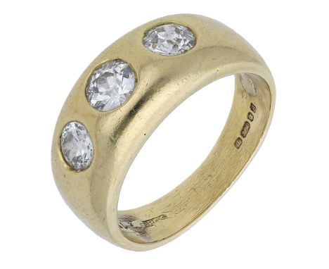 An 18ct gold three stone diamond ring, the tapered band bezel set with three transitional-cut diamonds, London hallmark for 1