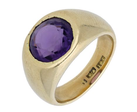 An amethyst ring, the circular-cut amethyst rubover set within a tapered mount, stamped ‘18C’, ring size approximately L.  £4