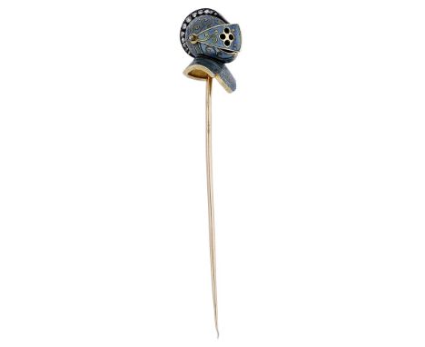 A late 19th century French enamel and diamond stick pin, the terminal modelled as a knight’s helmet, with hinged pierced viso