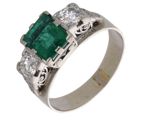 An emerald and diamond ring, circa 1940, the square-cut emerald claw set between two brilliant-cut diamonds, to single-cut di