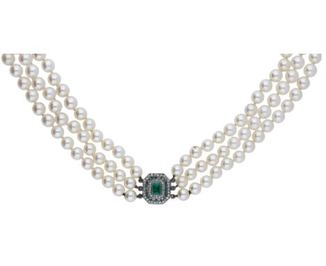 A cultured pearl necklace with emerald and diamond clasp,  the three rows of graduated cultured pearls to an Art Deco clasp s