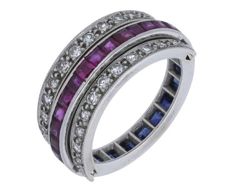 An Art Deco ‘Day and Night’ swivel ring, the central band set to one side with calibré rubies, the other with similarly-cut s