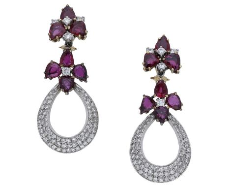 A pair of ruby and diamond earrings, the articulated surmounts each formed as a cluster of pear-shaped rubies and brilliant-c