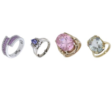 Four gem-set rings, comprising an 18ct gold pavé-set pink sapphire and diamond crossover ring, a tanzanite and diamond cluste