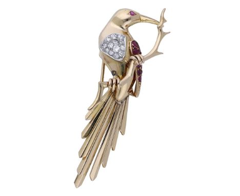 A ruby and diamond bird clip brooch, the bird seated on a branch, its breast inset with a panel of brilliant and single-cut d