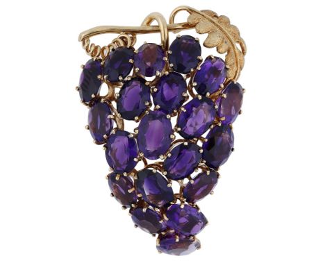 A fruiting vine amethyst brooch, composed of oval mixed-cut amethysts realistically modelled as a bunch of grapes, with polis